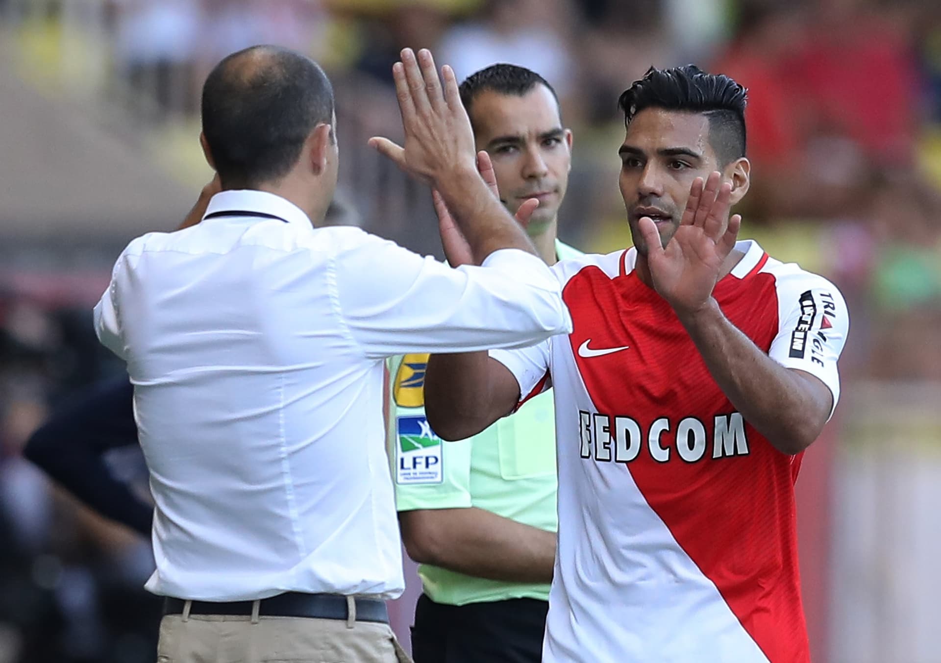 Monaco's Colombian forward Radamel Falcao (R) celebrates with Monaco's Portuguese coach Leonardo Jardim (L) during the French L1 football match Monaco (ASM) vs Rennes (SRFC) on September 17, 2016 at the "Louis II Stadium" in Monaco